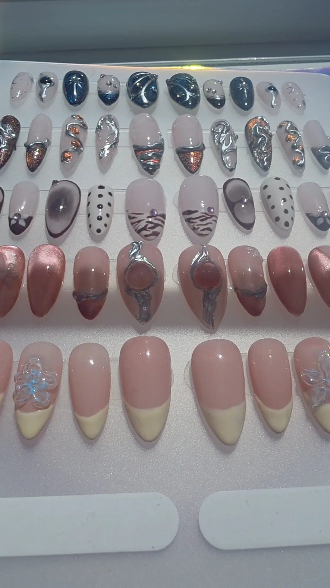 A collection of handmade press-on nail sets by Georgie