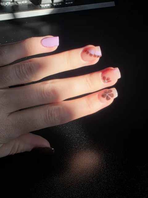 Minimal gel nails with tiny red hearts